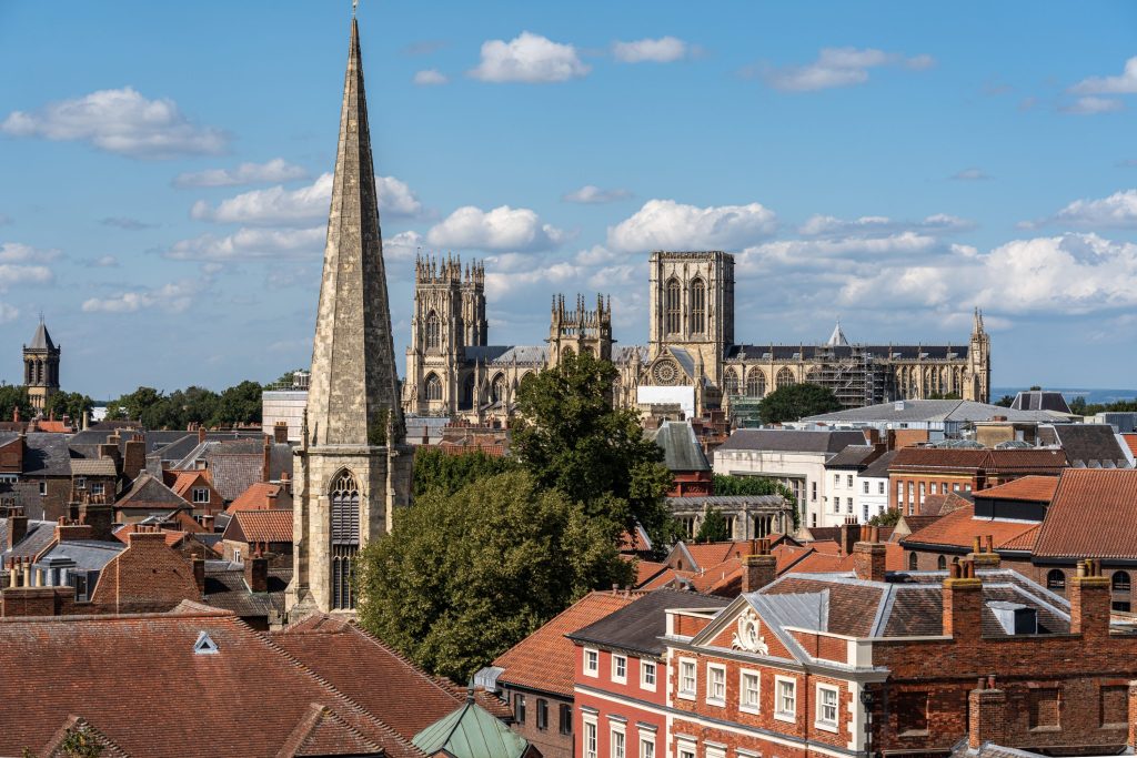 Knights enters its tenth city with new office in York - A view of a city with a church in the background.