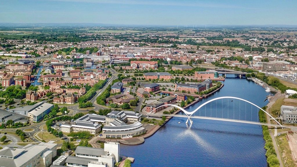 Knights completes North East acquisition and welcomes new colleagues - A view of a city with a bridge over a river.