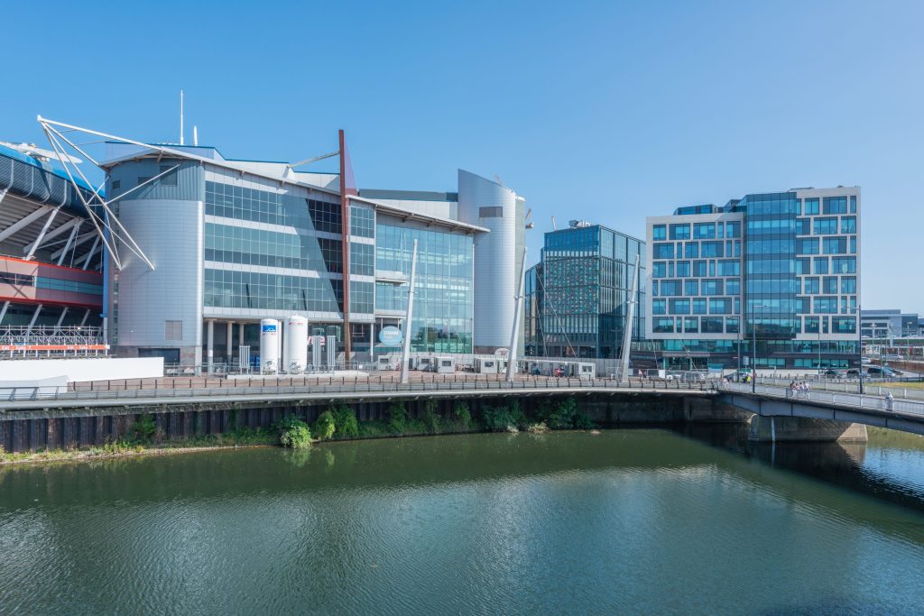 Knights hires expert property team ahead of Cardiff office opening - A large building with a bridge over a body of water.