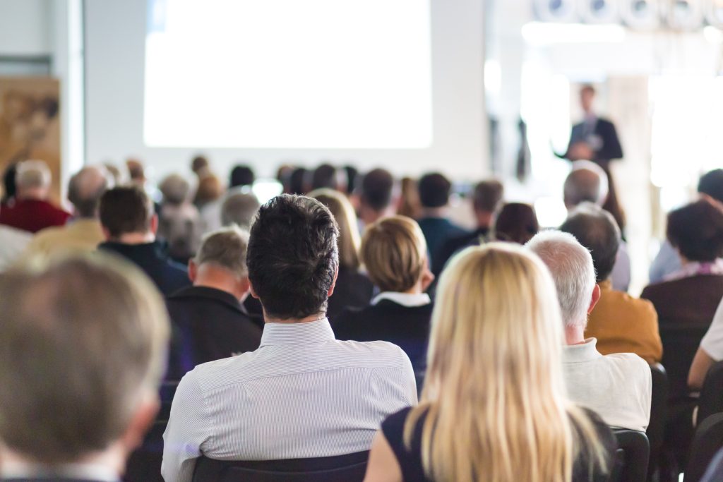 Knights Legal Services - A large group of people sitting in front of a projector screen.