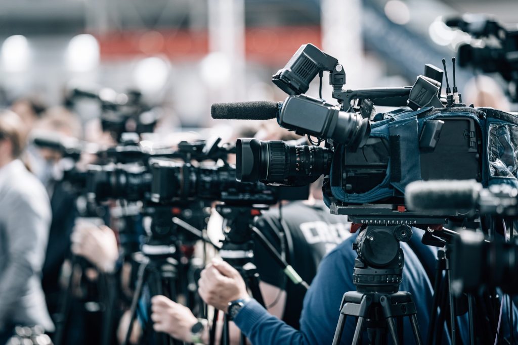Knights Legal Services - A group of people standing in front of a camera.