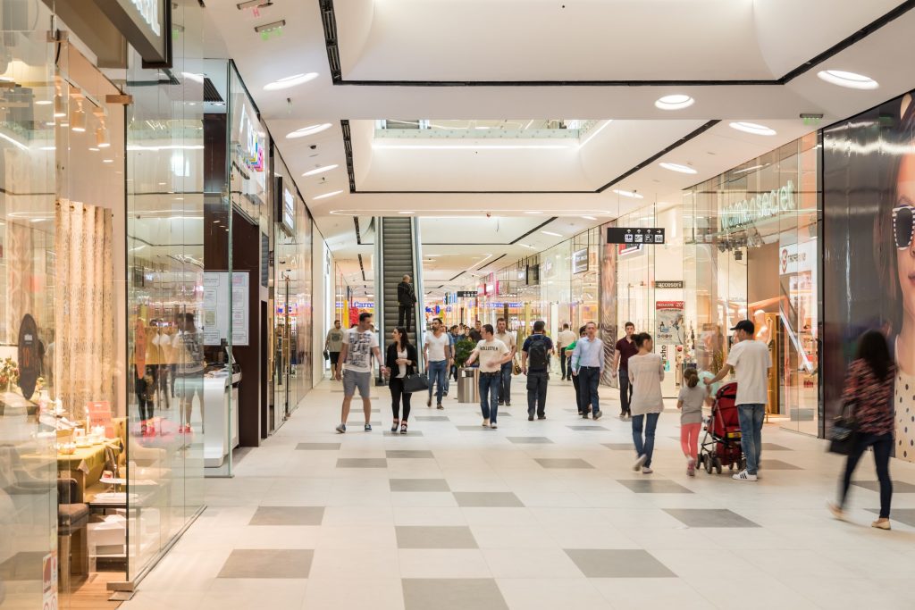Knights Legal Services - A large group of people walking through a shopping mall.
